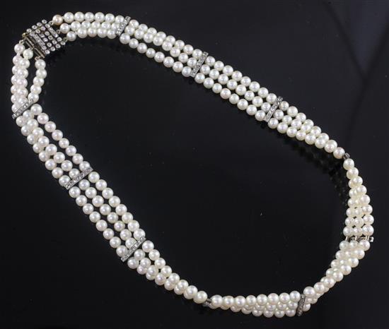 A 1920s/1930s three row cultured pearl and diamond set choker necklace, 36cm.